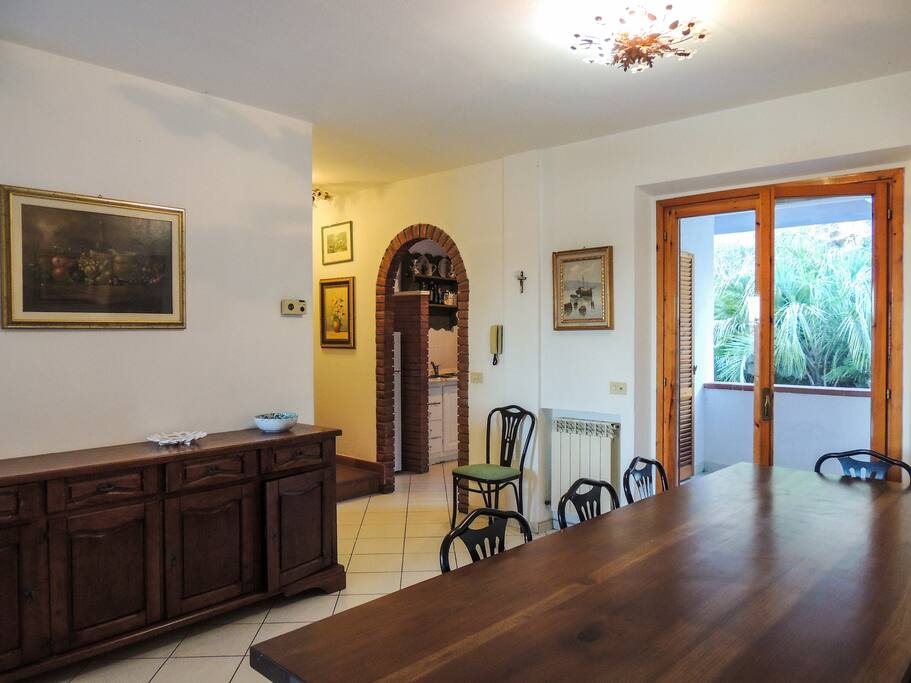 Dining room opening to terrace and garden