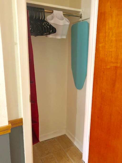 Coat closet, ironing board, & iron