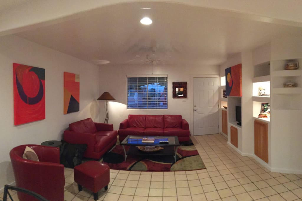 Living area has a built-in entertainment area with TV and books