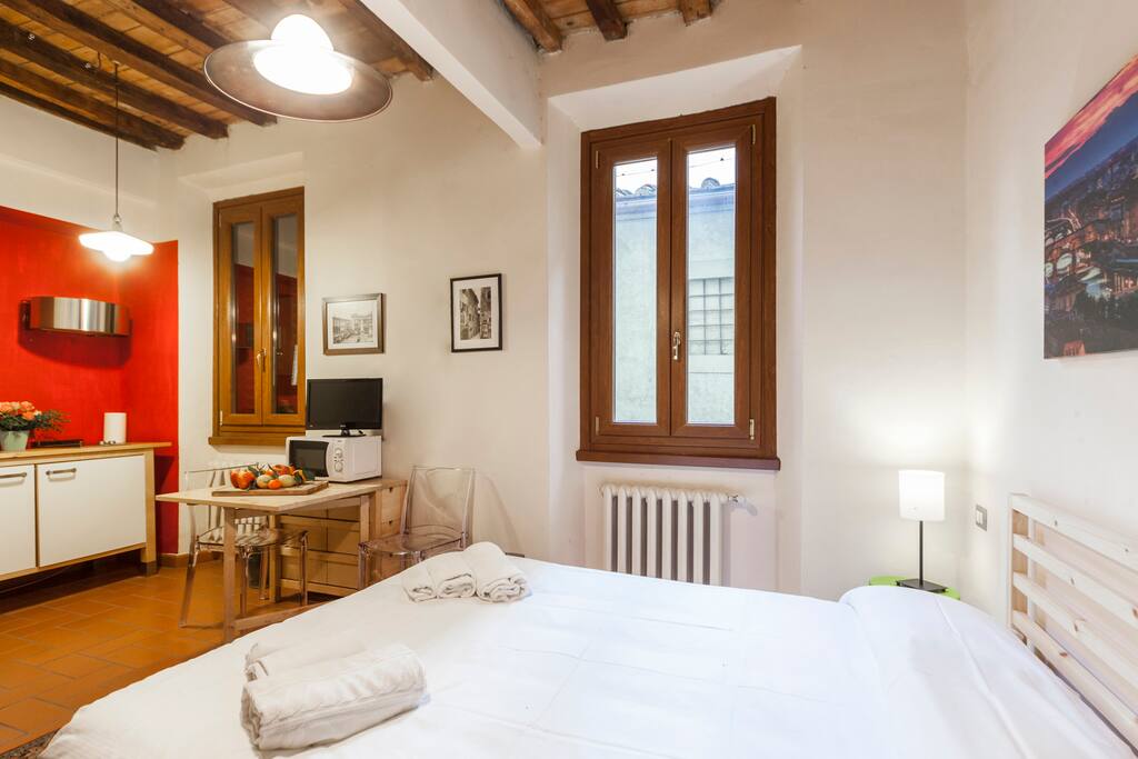 Studio with kitchen corner and bed
