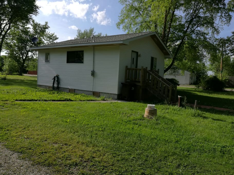 South side view of the house with its lush green surrounding.