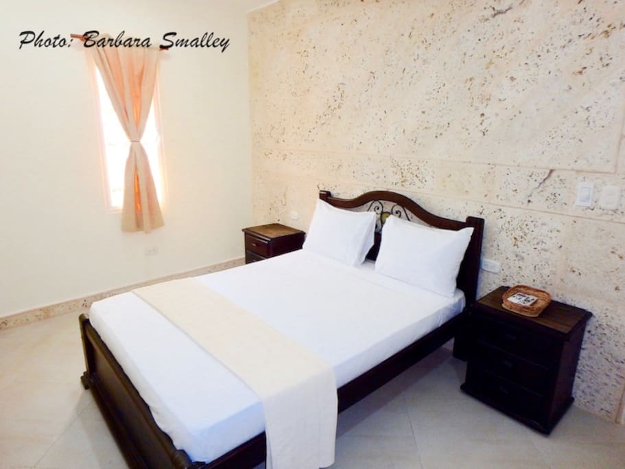 Bedroom with double bed, TV, & en suite full bath