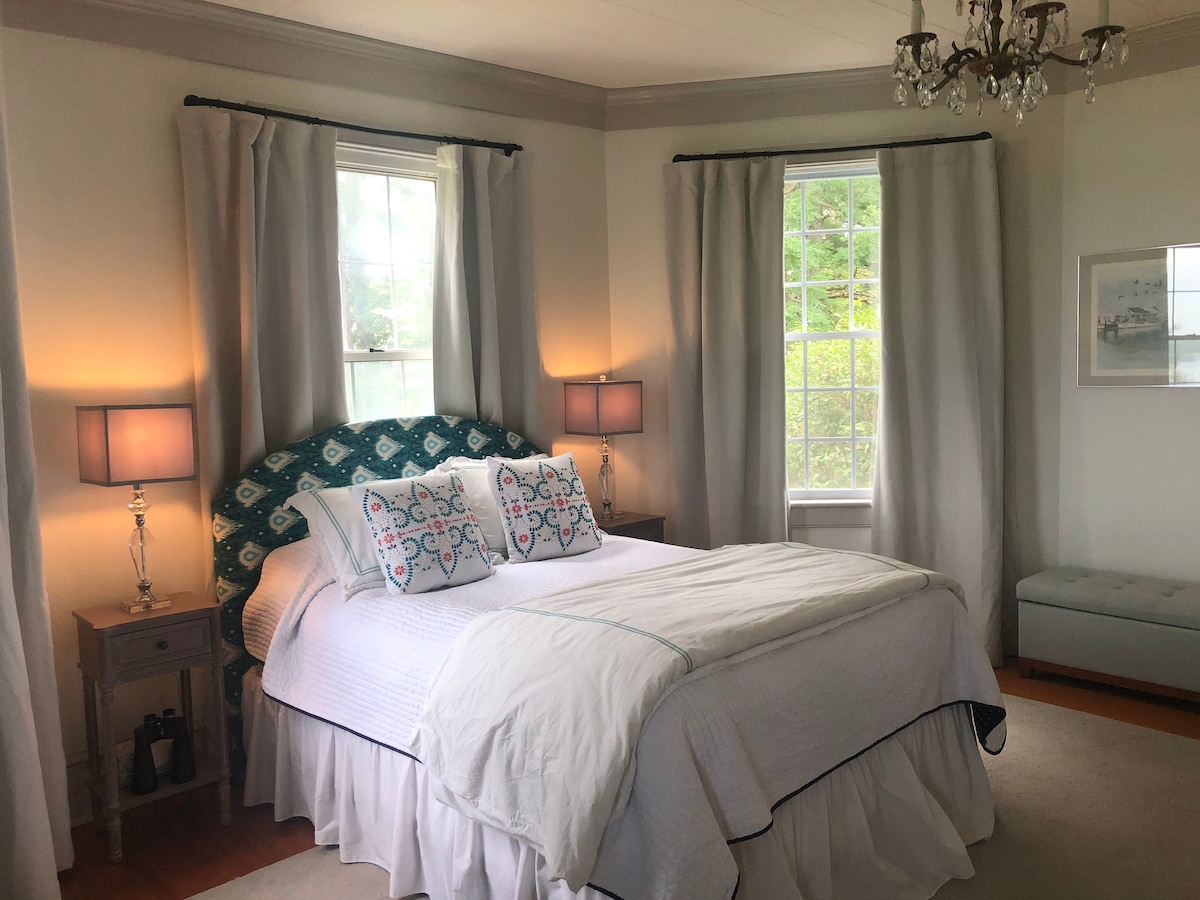 Serenity now! A calming 1st floor master suite surrounded by water views. Black out drapes for sleeping in. 