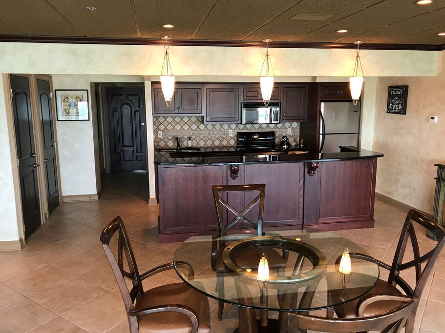 Full kitchen with pots/pans, spices, empty refrigerator/freezer (except ice)! Silverware, plates and other necessities provided! Coffee pot will be ready for you to brew and a toaster ready to go!