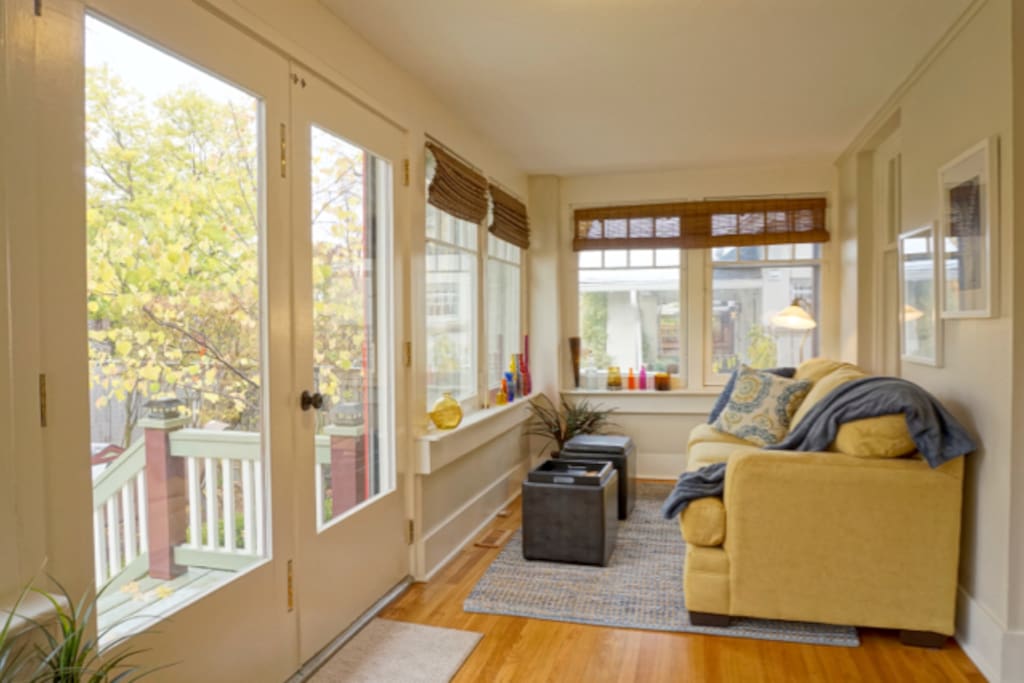 This sunny and bright sunroom is perfect for relaxing!