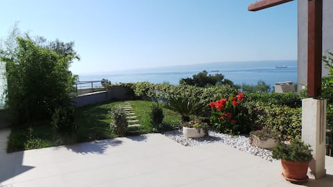 Elegant sea view beach front apartment with garden