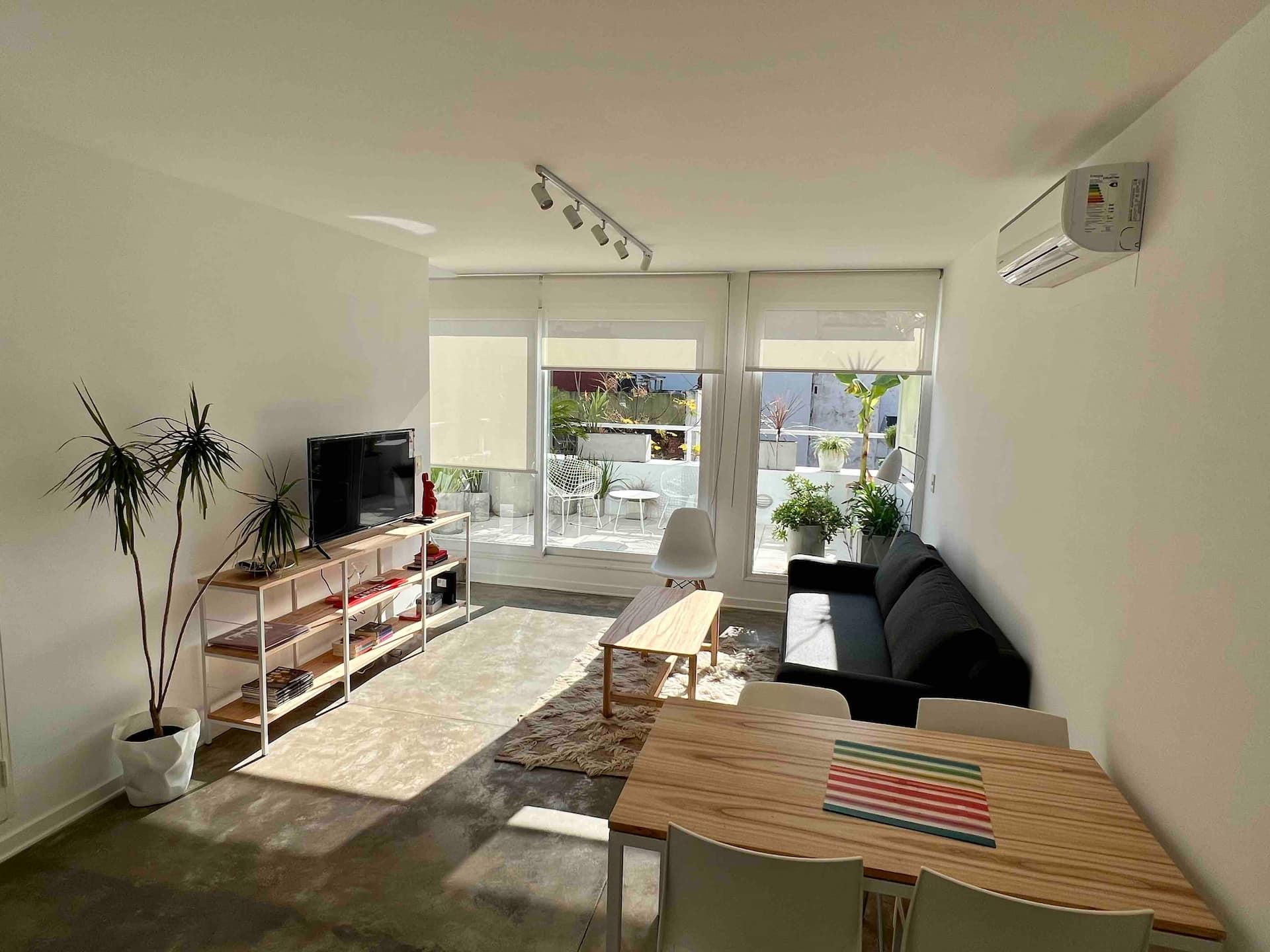 A bright duplex with a balcony and terrace