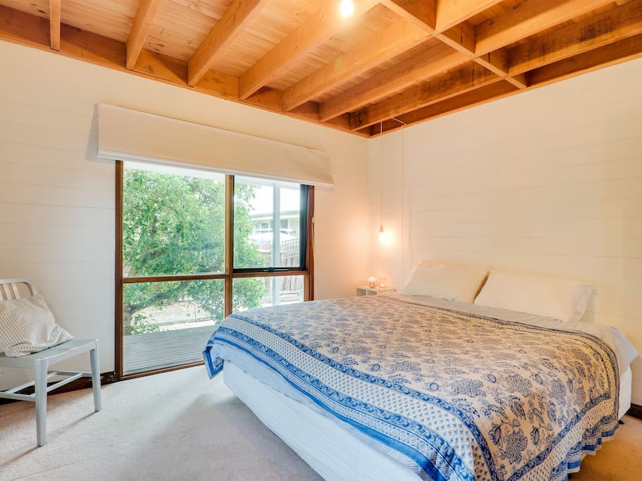 The main bedroom features a King Size bed and a roomy walk-in wardrobe.