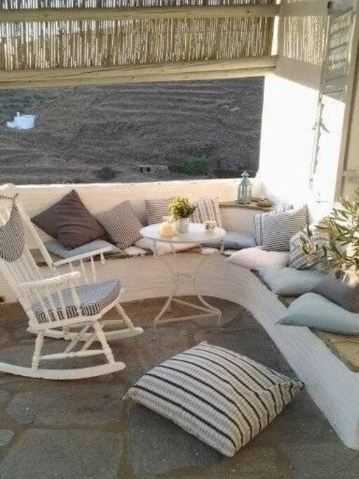 The cozy built-in seats at the big terrace out of the house.