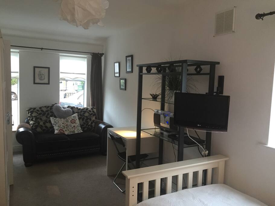 This room can accommodate a single bed or a double on request , also has a nice 2 seater couch to relax on with TV & DVD player and a nice collection of DVDs , it also has a wash hand basin and vanity unit