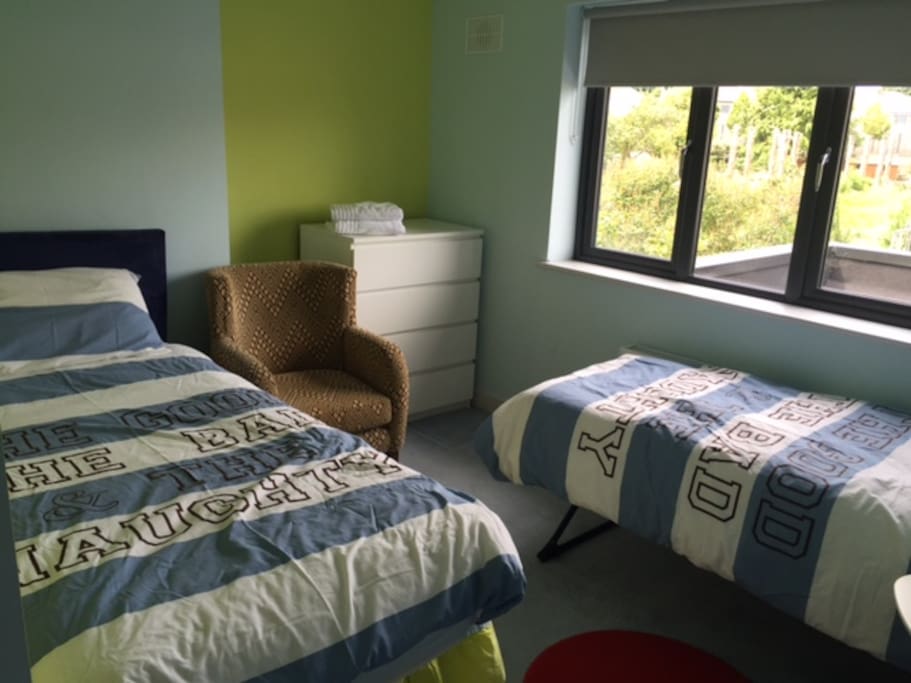 Bright Twin Room with Chest of Drawers and Wardrobe