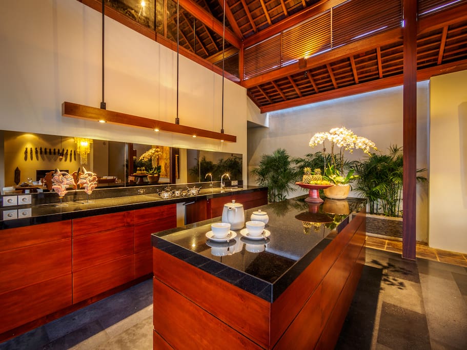 Open kitchen and bar attached with dining and living room