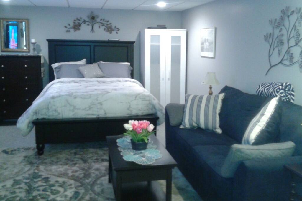 Couch, queen bed with under storage and armoire. Also available: Porta crib and a queen pop up air mattress.