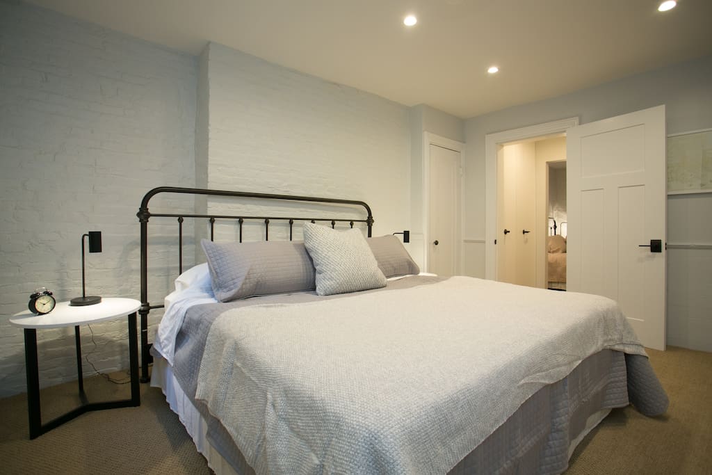 Sleep easily in quiet bedroom with king-sized bed.