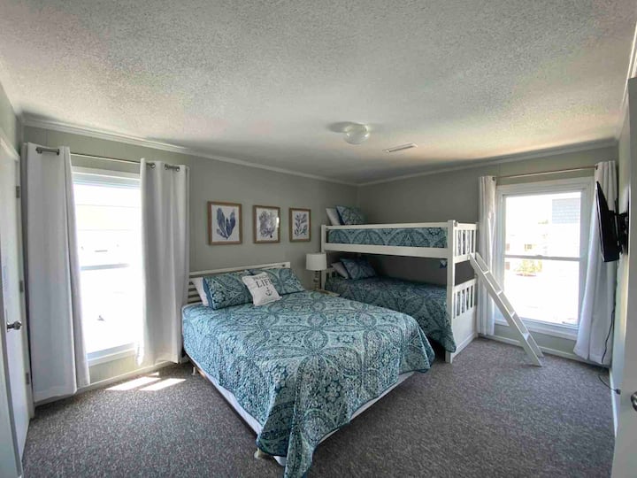 Retreat upstairs to bedroom #3 with room for 4 (1 queen + twin bunks) and 43” smart flat screen for downtime. Brand new AC units and ventwork  installed to keep it nice and cool upstairs!