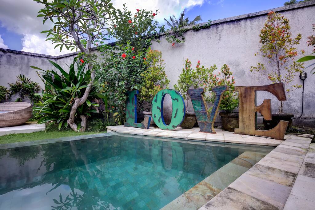 Love sign and the garden in front of the bedroom