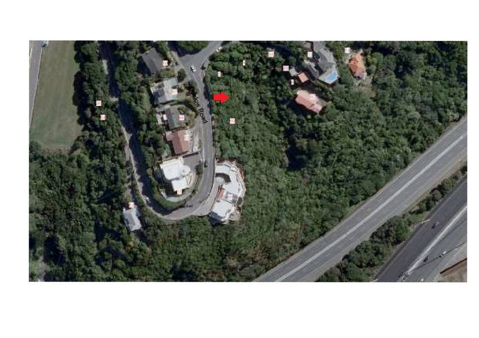 The Green Hutt is located where the red arrow is and next to the arrow is a walk way with white pitted fence down to the Hut.