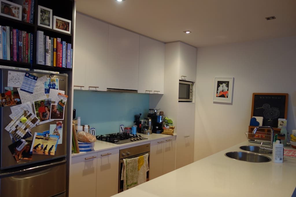 Fully stocked kitchen with Miele appliances, double sink and breakfast bar