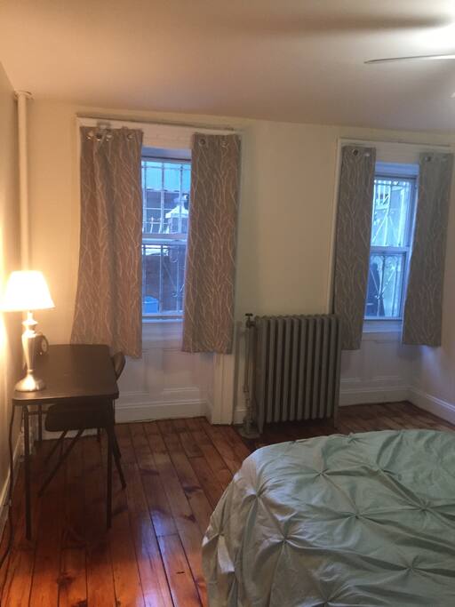 Your room has 2 windows that face the street, hardwood floors, desk area