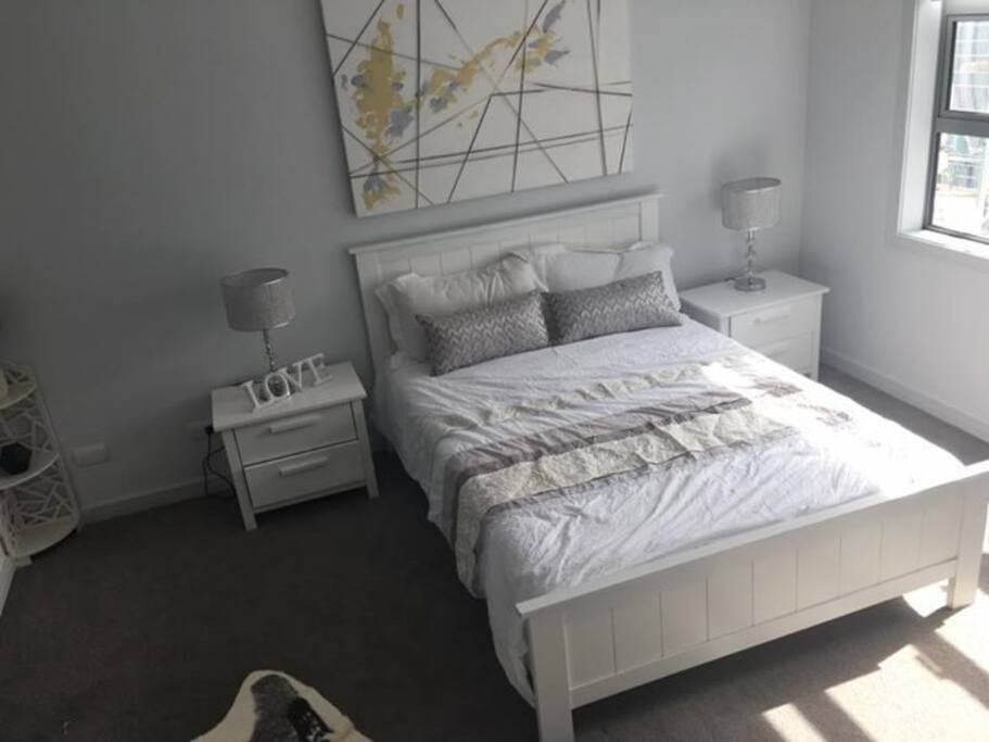 The room is large, with a lot of room to move around. It also has a walk in wardrobe.