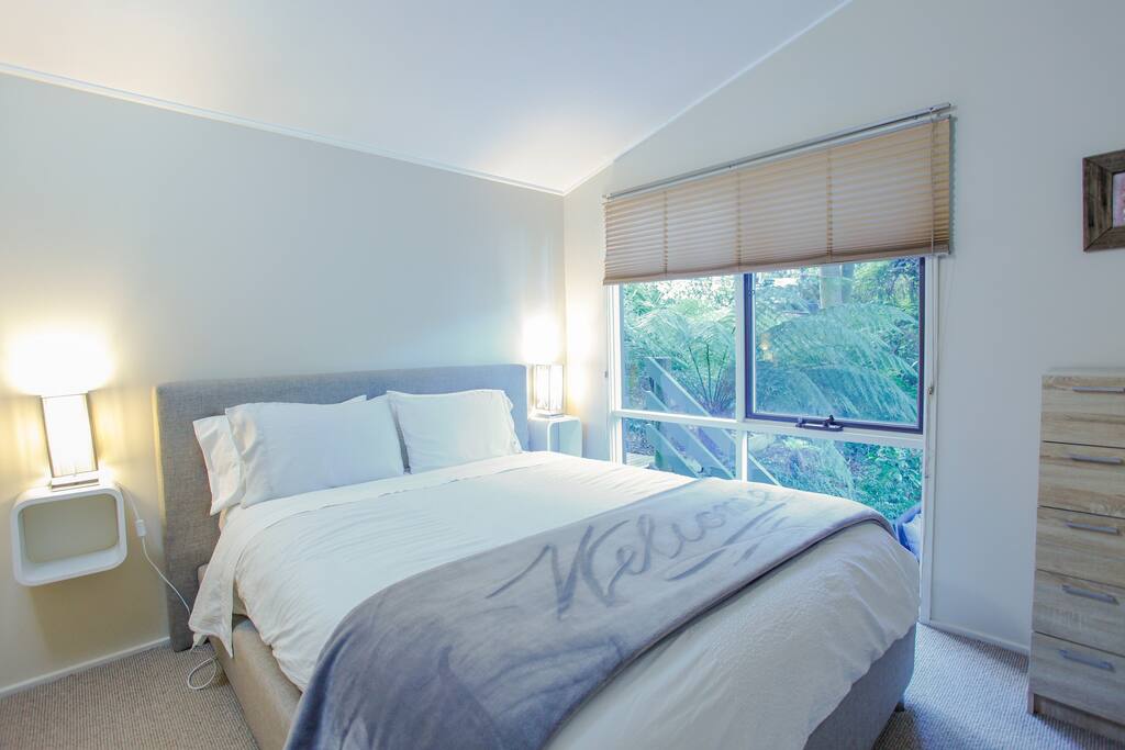 Queen bed with beautiful outlook 2nd bedroom