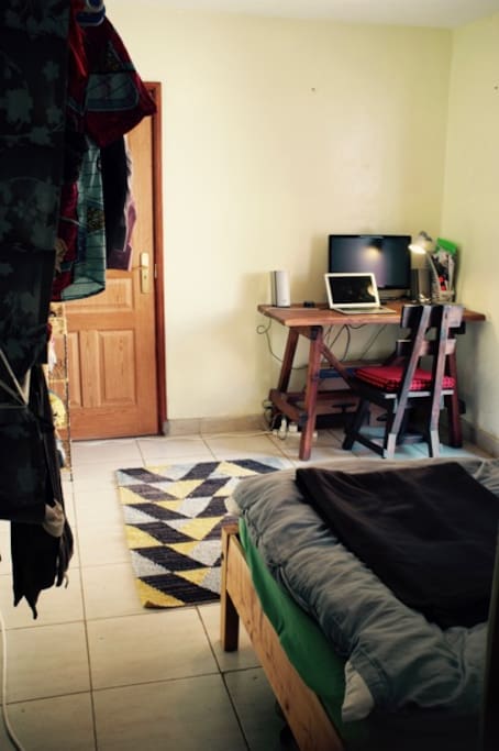The room, functional and not too small, great desk and space to hang your clothes
