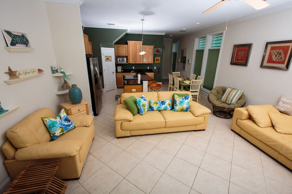 Large tile living room with plenty of leather seating