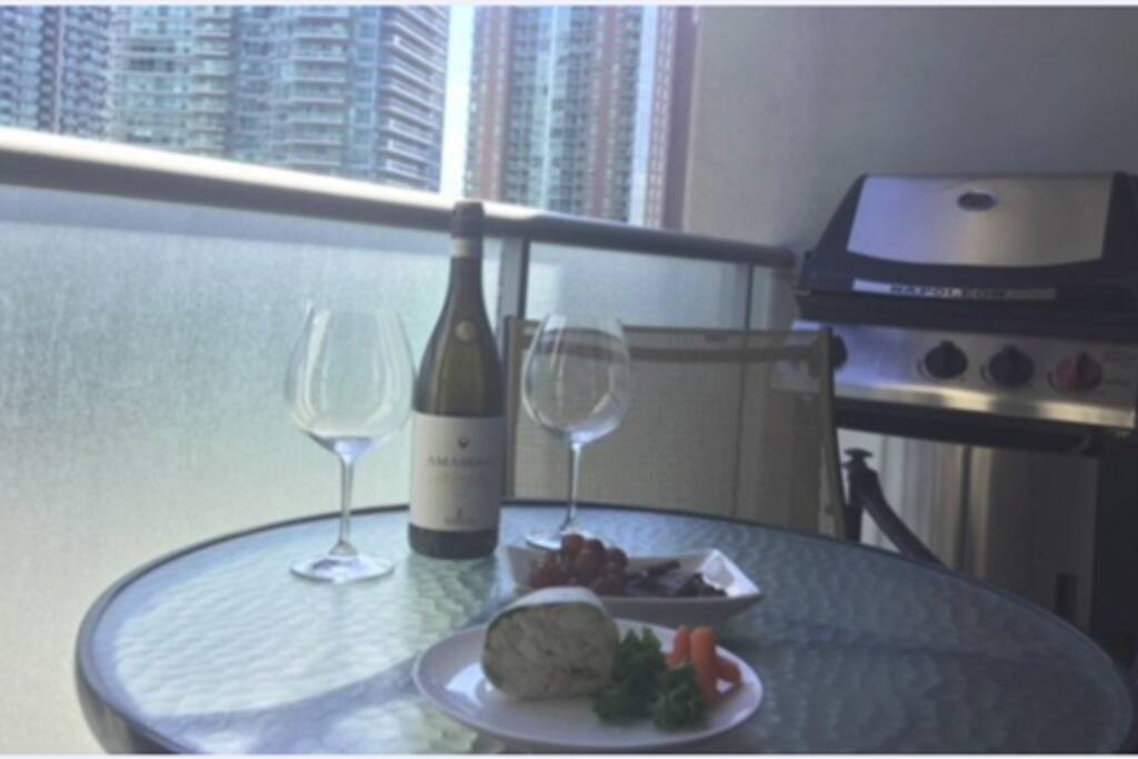 Private balcony complete with natural gas Napoleon BBQ and top-end patio set