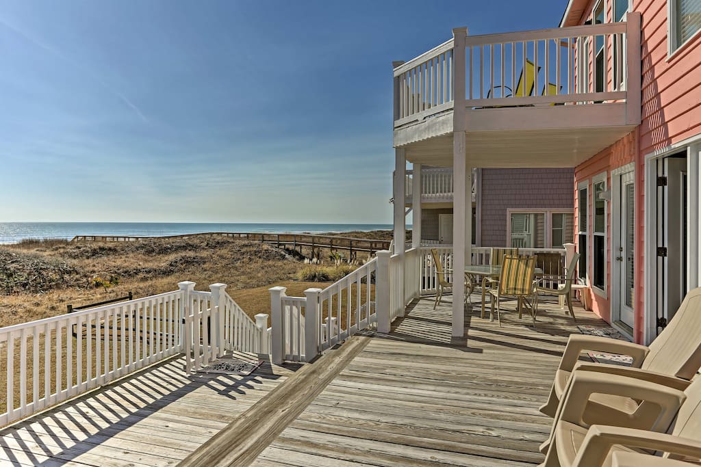 'The Pink House' boasts 4 bedrooms, 3 baths, room for 14, and 2,200-square-feet.