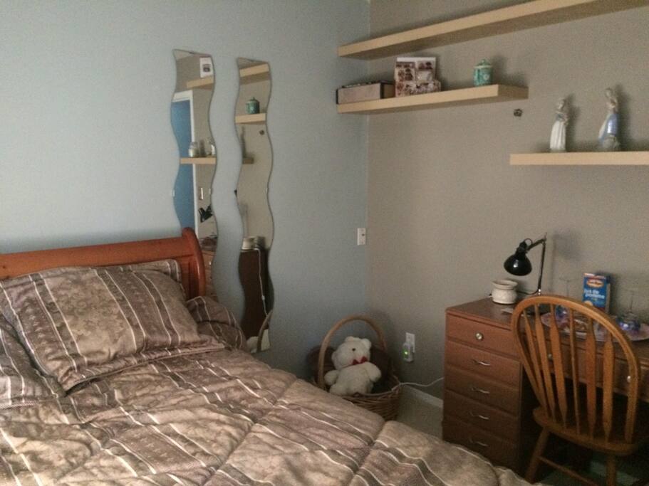 Queen bed also s sleigh bed, extra pillows. Owl Room