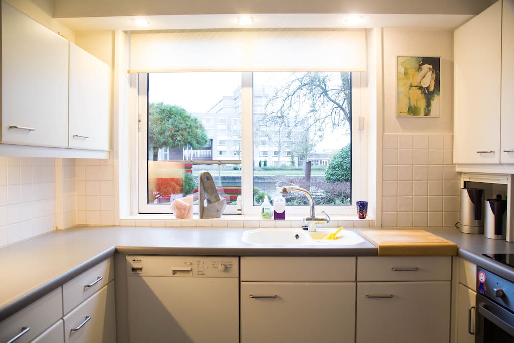 Fully equipped, luxury kitchen with view of garden