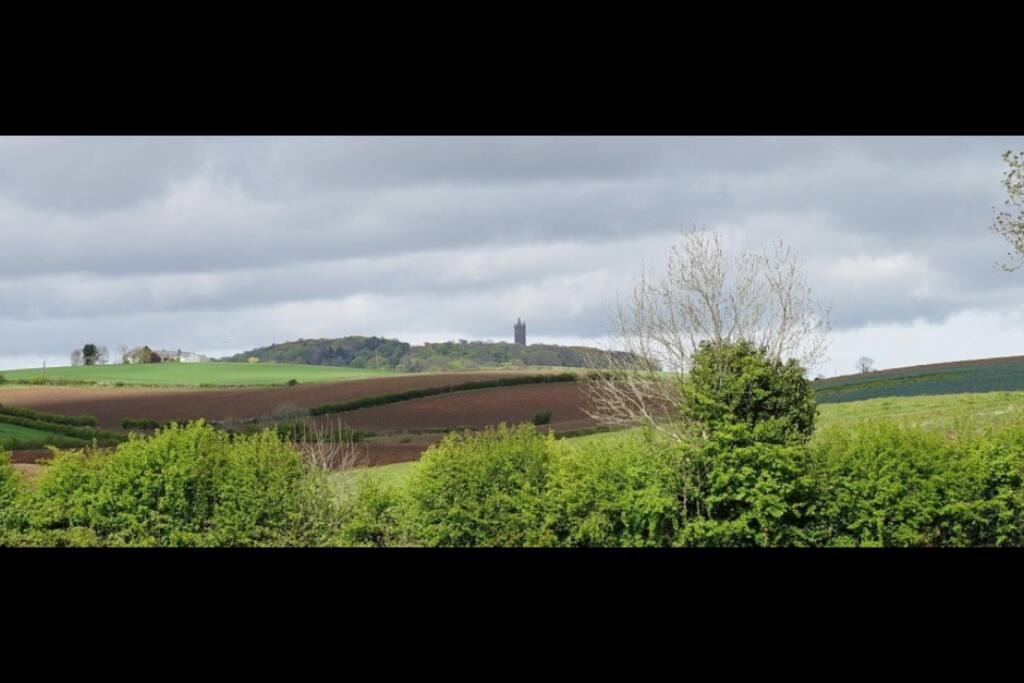 Imagine waking up to this gorgeous view of a historical tower and rolling hills