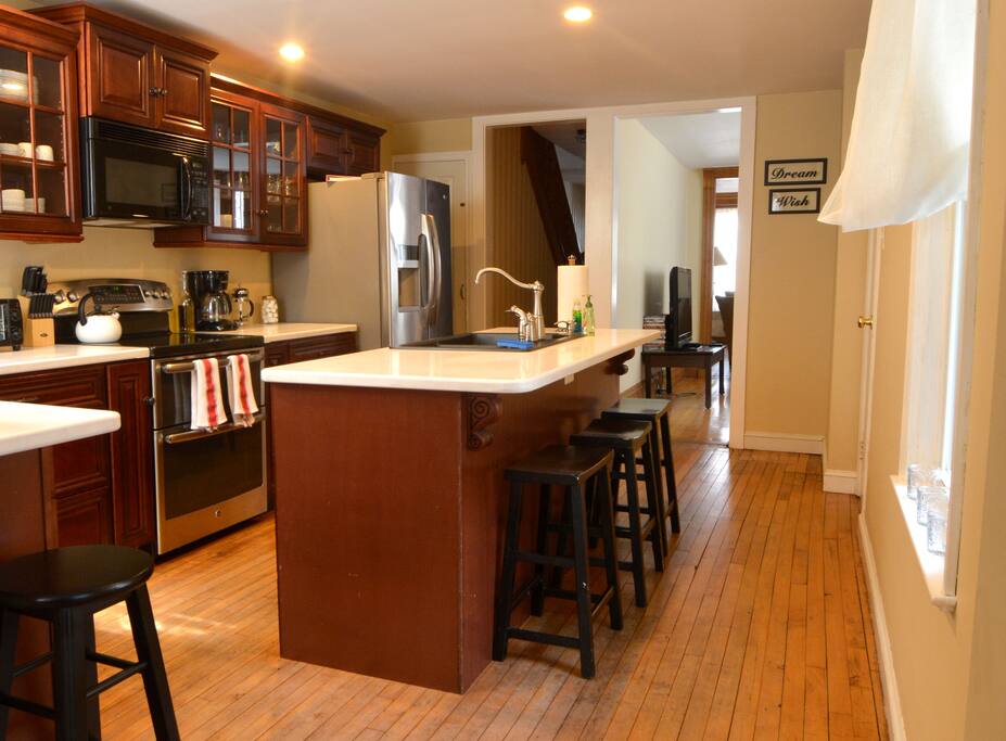 Large and very well equipped kitchen with stainless appliances including a double oven range