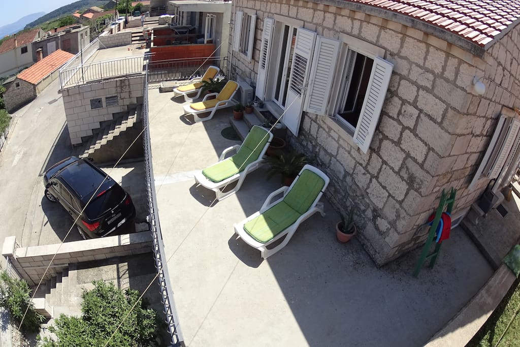 Sunny deck comes with four loungers and in front of the house you have a your own parking place where two cars can park..