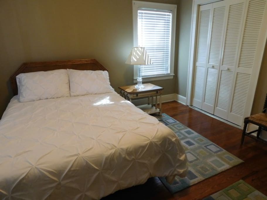 Master bedroom with queen size bed.