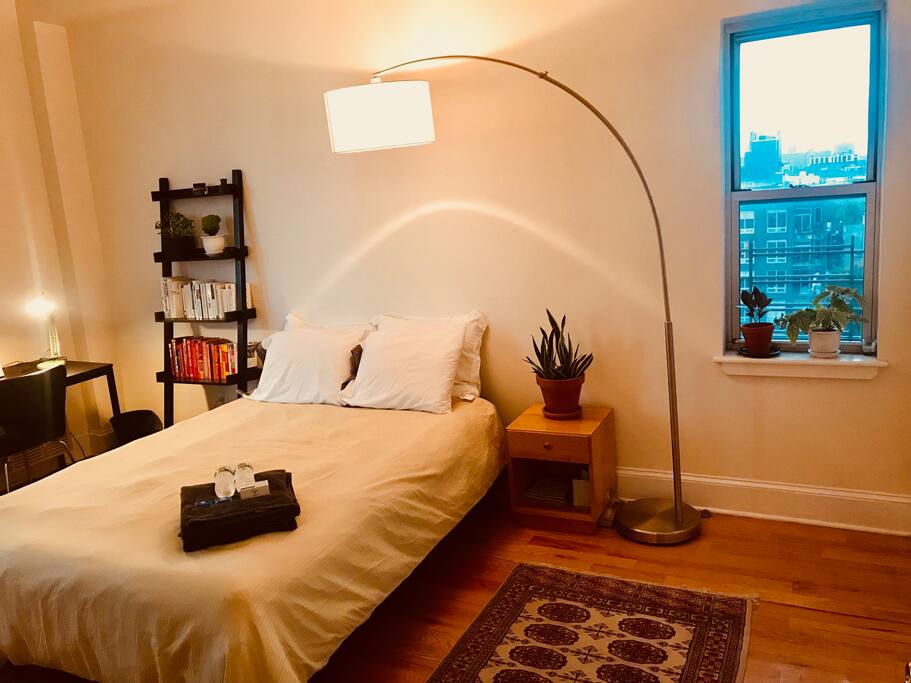 Here is the bedroom with overhead lamp, around sunset.