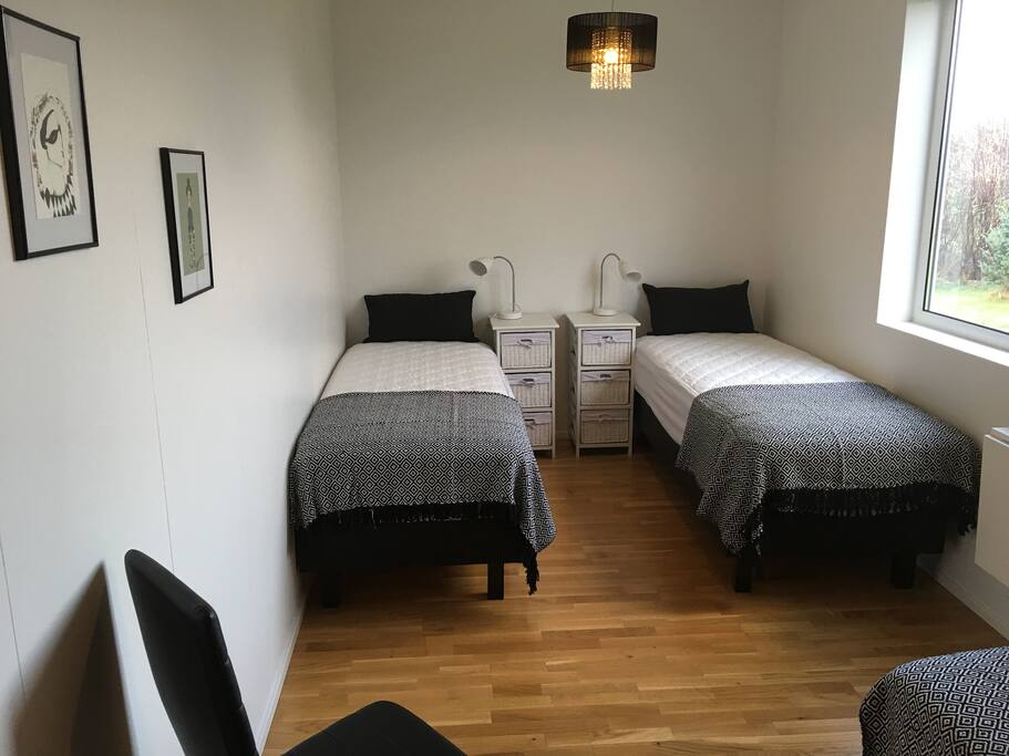 A view of the bedroom. The beds are new and can be attached together.