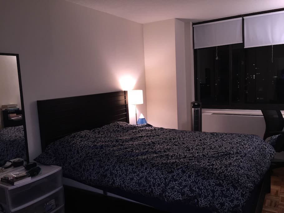 partial view of the bedroom with windows towards downtown.