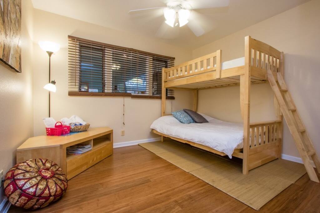This is the Brown Room. It fits 3 adults comfortably as long as 2 adults don't mind sharing a full size bed. We can bring in a twin size air mattress, but it will be tight! Not recommended during the summer.