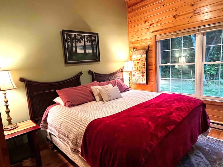 Second bedroom (king bed) with private bathroom across hallway. 