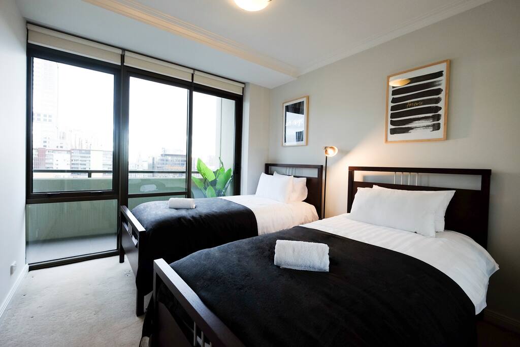 The second bedroom with two single beds.