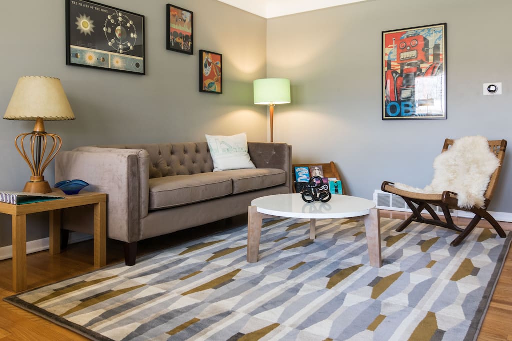 Comfortable Living room with a mix of new and mid century furnishings and art.