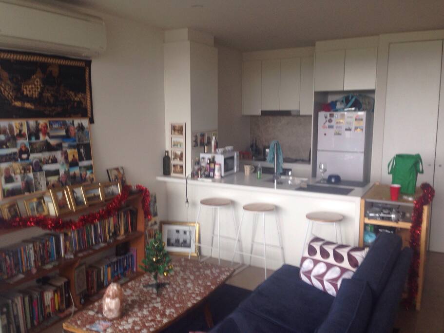 Living room looking into kitchen, with the Christmas decorations up :)