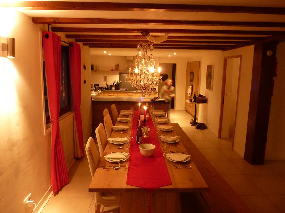 Dining area, showing fully-equipped open plan kitchen behind