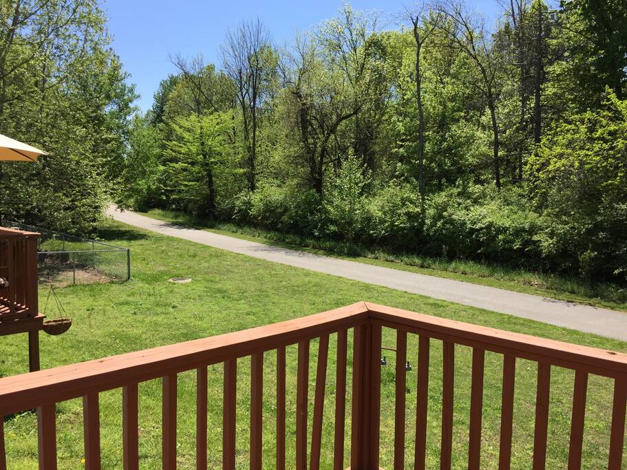 Deck and view of walking/jogging trail behind property