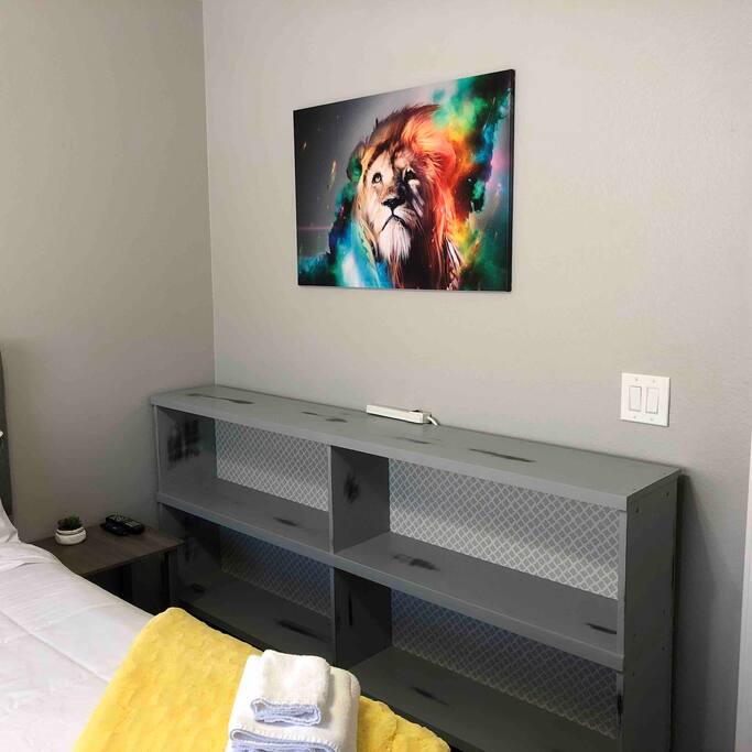 Lots of shelf space in the room and outlets to charge your devices
