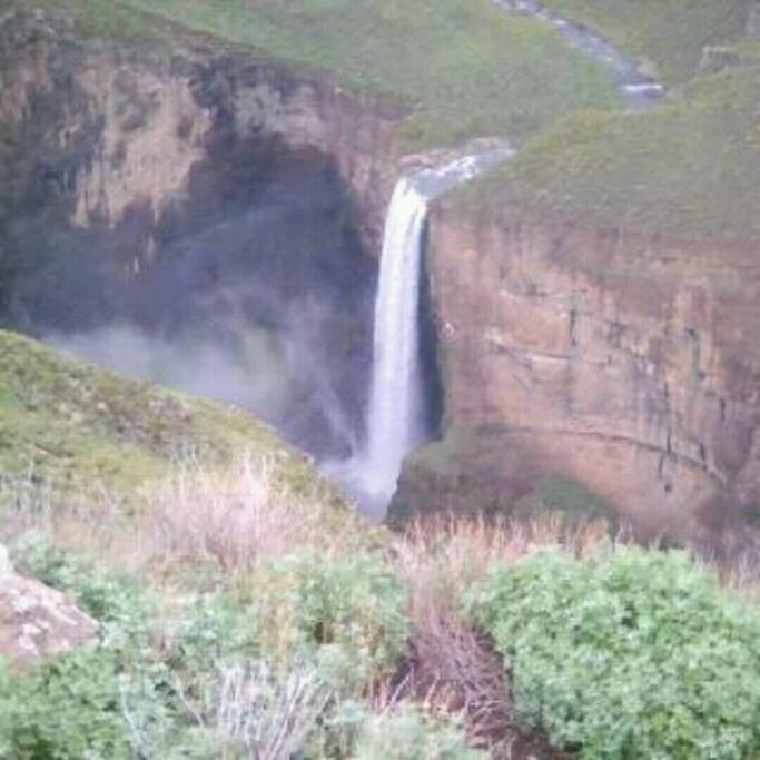 A spectacular water fall viewed in assistance of a registered tour guides in moorosi chalets.