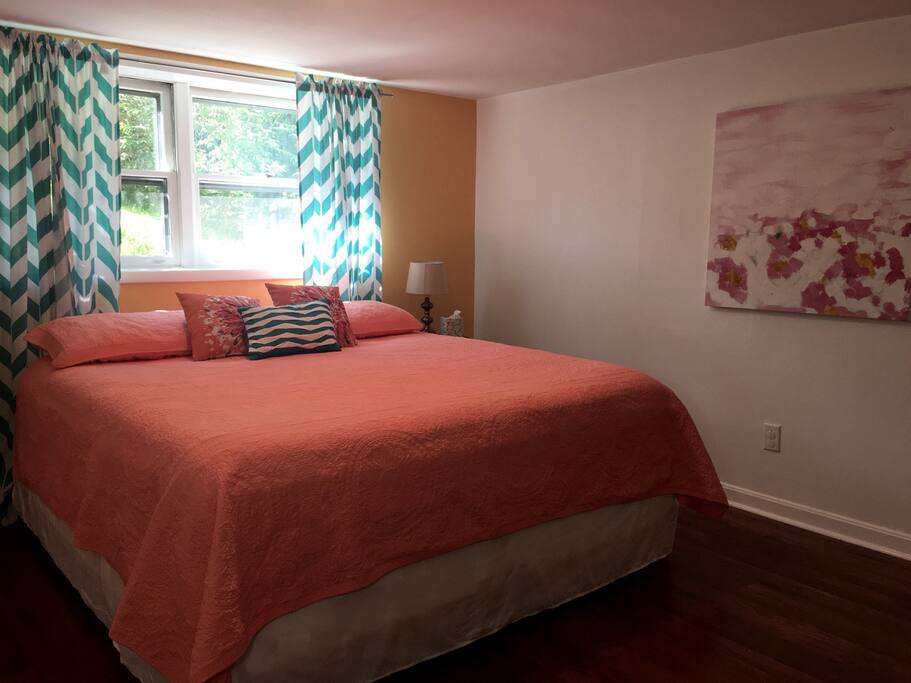 The larger bedroom has a king-sized bed.
