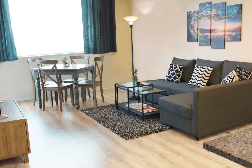 Spacious living room and dining area with a 50 inch HDTV. FREE Netflix and HBO.