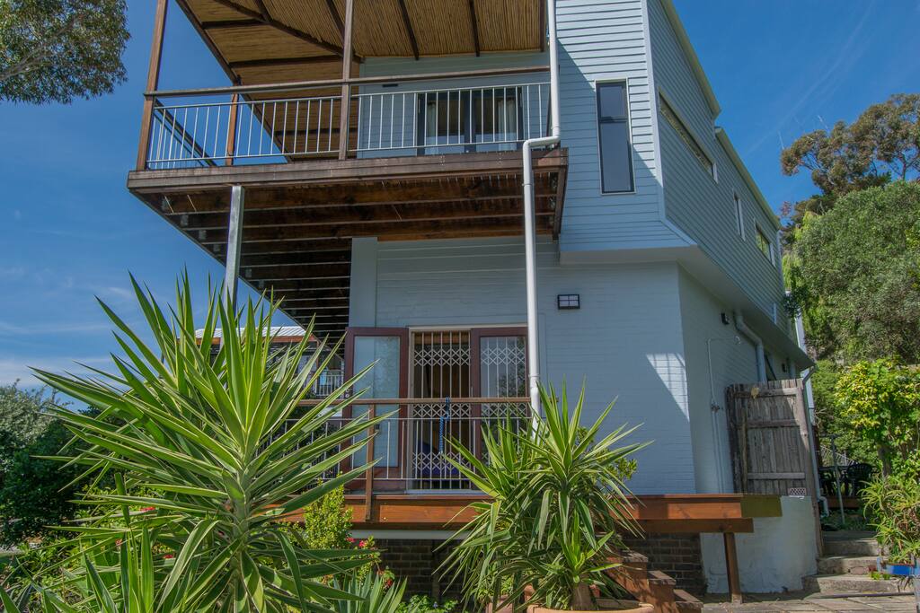 Side of house with 2 wraparound balconies